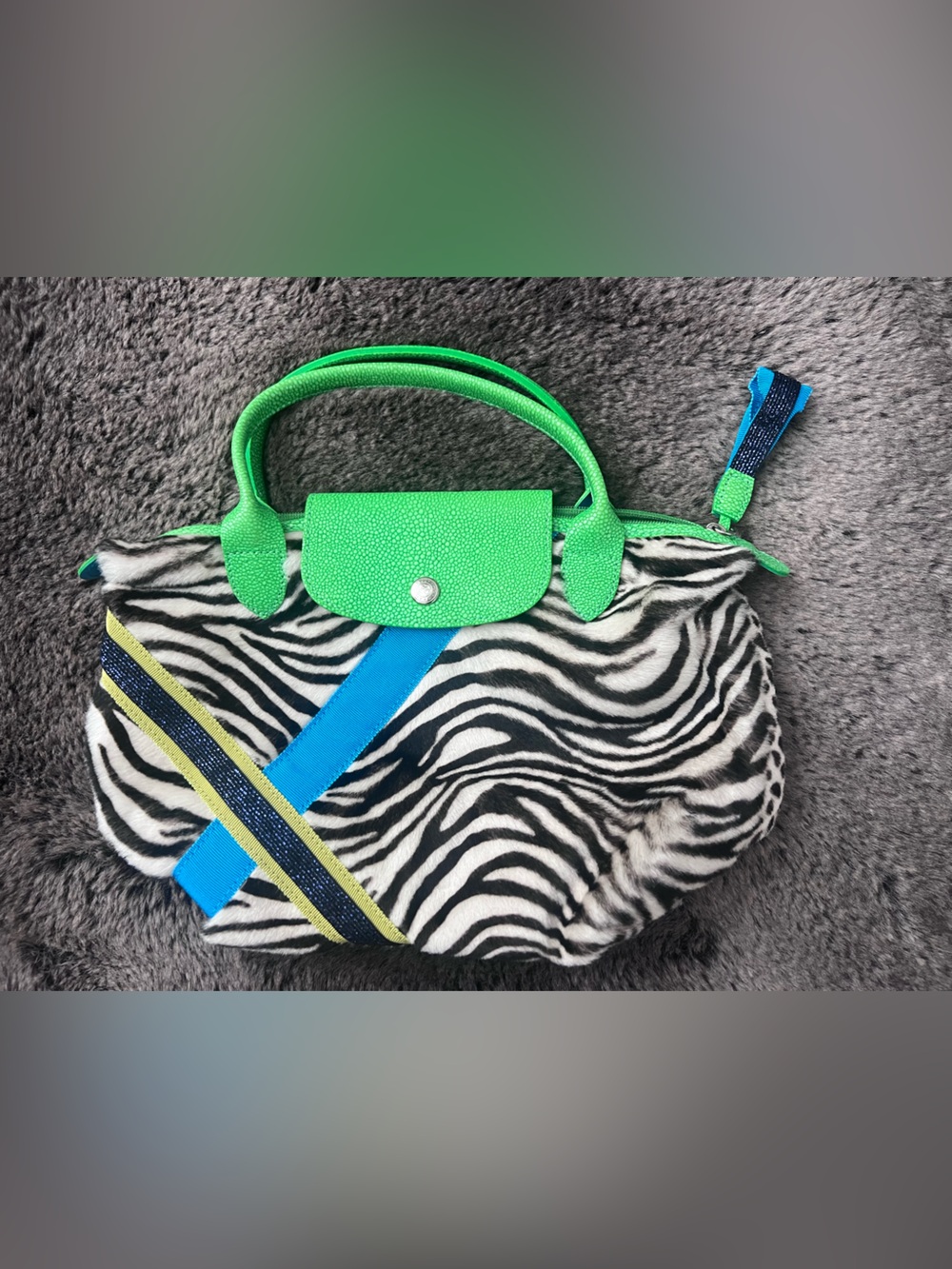Longchamp Zebra Print Top-Handle Bag with Green Handles and Blue Accents